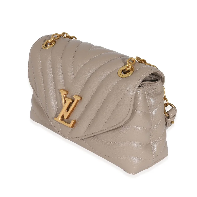 Water-resistant travel backpacks  Louis Vuitton Dark Taupe Quilted Calf New Wave Chain MM