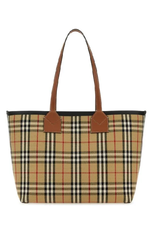 Designer bags for women  Burberry Woman Embroidered Canvas Medium London Shopping Bag